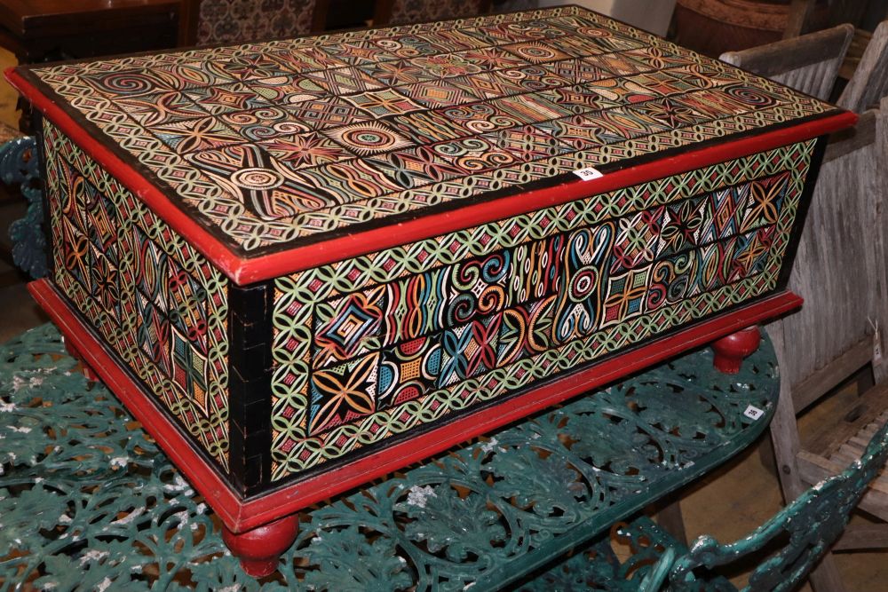 An Indonesian carved painted hardwood coffer, W.99cm, D.59cm, H.45cm